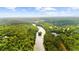 Aerial view of a serene river winding through lush green trees with visible homes and community features at 9005 Old Southwick Pass, Alpharetta, GA 30022