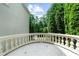 Wide angle shot of the balcony overlooking an array of tall trees and sky at 9005 Old Southwick Pass, Alpharetta, GA 30022