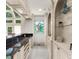Wet bar with custom cabinetry, granite countertop, and stained glass window at 9005 Old Southwick Pass, Alpharetta, GA 30022