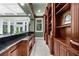The game room bar features beautiful cabinetry, granite counters and an integrated sink at 9005 Old Southwick Pass, Alpharetta, GA 30022