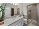 Inviting bathroom with a marble countertop, stylish fixtures, and a glass-enclosed shower at 9005 Old Southwick Pass, Alpharetta, GA 30022