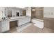 Bathroom with vanity, walk-in closet and a shower with gold trim and glass doors at 9005 Old Southwick Pass, Alpharetta, GA 30022