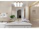 Bathroom with large mirror and gold hardware and a shower with gold trim and glass doors at 9005 Old Southwick Pass, Alpharetta, GA 30022