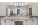 Well-lit bathroom vanity area with double sinks, granite countertop, and stylish bronze fixtures at 9005 Old Southwick Pass, Alpharetta, GA 30022