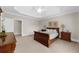 Bedroom with tray ceiling, neutral paint and large window with plantation shutters at 9005 Old Southwick Pass, Alpharetta, GA 30022