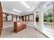 Spacious walk-in closet with built-in shelving, drawers, and natural light from a window at 9005 Old Southwick Pass, Alpharetta, GA 30022
