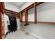 Walk-in closet offering generous storage with custom shelving and rods for hanging clothes at 9005 Old Southwick Pass, Alpharetta, GA 30022