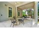 Spacious covered patio area perfect for outdoor entertaining with comfortable seating and ceiling fans at 9005 Old Southwick Pass, Alpharetta, GA 30022