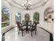 Bright dining room with large windows overlooking the garden at 9005 Old Southwick Pass, Alpharetta, GA 30022