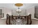 Elegant foyer with a grand staircase, wrought iron railings, and a striking chandelier at 9005 Old Southwick Pass, Alpharetta, GA 30022
