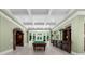 Entertaining game room features a pool table, a bar area, coffered ceilings and lots of natural light at 9005 Old Southwick Pass, Alpharetta, GA 30022