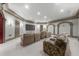 A comfortable media room features a large screen and multiple seating arrangements at 9005 Old Southwick Pass, Alpharetta, GA 30022