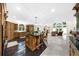 Open kitchen and living area with hardwood cabinets and large windows at 9005 Old Southwick Pass, Alpharetta, GA 30022
