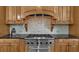 A chef's kitchen with modern appliances and hardwood cabinets at 9005 Old Southwick Pass, Alpharetta, GA 30022