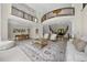 Bright and airy living room with high ceilings, an open balcony, and large windows offering natural light at 9005 Old Southwick Pass, Alpharetta, GA 30022