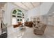 Bright living room with high ceiling, large windows, and comfortable seating area at 9005 Old Southwick Pass, Alpharetta, GA 30022