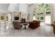 Bright living room with a stone fireplace and large windows at 9005 Old Southwick Pass, Alpharetta, GA 30022