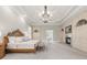 Spacious main bedroom with a fireplace, sitting area, and decorative ceiling at 9005 Old Southwick Pass, Alpharetta, GA 30022