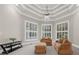 Cozy sitting room with comfortable seating, natural light, and custom ceiling at 9005 Old Southwick Pass, Alpharetta, GA 30022