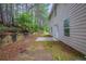 A spacious backyard with lush greenery and a patio at 450 Pinevale Ct, Atlanta, GA 30349