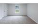 Bedroom with neutral walls, carpet, and natural light from window at 450 Pinevale Ct, Atlanta, GA 30349