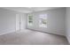 This bedroom has neutral walls, carpet, and natural light at 450 Pinevale Ct, Atlanta, GA 30349