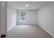 This bedroom has neutral walls and plush carpet at 450 Pinevale Ct, Atlanta, GA 30349