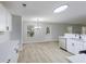 Bright kitchen and dining area with stainless steel appliances and wood-look flooring at 450 Pinevale Ct, Atlanta, GA 30349