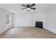 Cozy living room featuring a fireplace, hardwood floors, and ample natural light at 450 Pinevale Ct, Atlanta, GA 30349