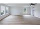 Large living room showcasing hardwood floors, natural light, and an open layout at 450 Pinevale Ct, Atlanta, GA 30349
