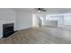 Open living room featuring fireplace, stairs to second floor, and access to kitchen at 450 Pinevale Ct, Atlanta, GA 30349