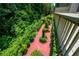 Backyard view with lush greenery and a charming red brick pathway, perfect for outdoor enjoyment at 4540 Fourth Rail Ln, Cumming, GA 30040
