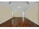 Bedroom features hardwood floors, trey ceiling, neutral paint, and a ceiling fan at 4540 Fourth Rail Ln, Cumming, GA 30040