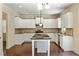 Bright kitchen with white cabinets, granite countertops, stainless steel appliances, and an island at 4540 Fourth Rail Ln, Cumming, GA 30040