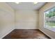 Walk-in closet with hardwood floors, white wire shelving and a window for natural light at 4540 Fourth Rail Ln, Cumming, GA 30040