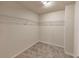 Spacious walk-in closet with carpeting and wire shelving for organized storage at 513 Moline Way, Locust Grove, GA 30248