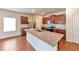 Well-equipped kitchen with an island, stainless steel appliances, granite counters, and ample cabinet space at 513 Moline Way, Locust Grove, GA 30248