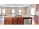 Beautiful kitchen showcasing stainless steel appliances, a granite island, and an open layout at 513 Moline Way, Locust Grove, GA 30248