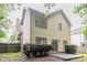 Back exterior view of home with siding, chimney, sliding glass door, and patio at 847 Ashley Ln, Stone Mountain, GA 30087