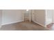 Neutral bedroom with carpeted floors and view to an adjoined bathroom at 847 Ashley Ln, Stone Mountain, GA 30087
