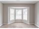 Bright bedroom featuring a bay window and carpeted floors at 847 Ashley Ln, Stone Mountain, GA 30087