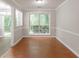 Bright dining area features neutral walls, tile floors, chair railing and natural light at 847 Ashley Ln, Stone Mountain, GA 30087