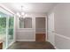 Bright dining room with a view to the backyard and an entry into the living room at 847 Ashley Ln, Stone Mountain, GA 30087