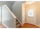 Inviting entryway with hardwood floors, white trim, and a staircase leading to the upper level at 847 Ashley Ln, Stone Mountain, GA 30087