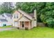 Charming two-story home with a bay window, covered porch, attached garage and lush lawn at 847 Ashley Ln, Stone Mountain, GA 30087