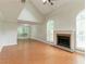 Spacious living room with fireplace, crown molding, large windows, and hardwood floors at 847 Ashley Ln, Stone Mountain, GA 30087