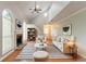 Bright living room with vaulted ceilings, a fireplace, arched windows, and elegant furnishings at 847 Ashley Ln, Stone Mountain, GA 30087