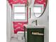 Vibrant bathroom with pink wallpaper, green vanity, and hexagon tile flooring at 1136 Moreland Se Pl, Atlanta, GA 30316