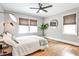 Cozy bedroom offers hardwood floors, two windows, and a ceiling fan at 1136 Moreland Se Pl, Atlanta, GA 30316