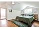 Spacious bedroom featuring hardwood floors, a vaulted ceiling, and a modern design at 1136 Moreland Se Pl, Atlanta, GA 30316